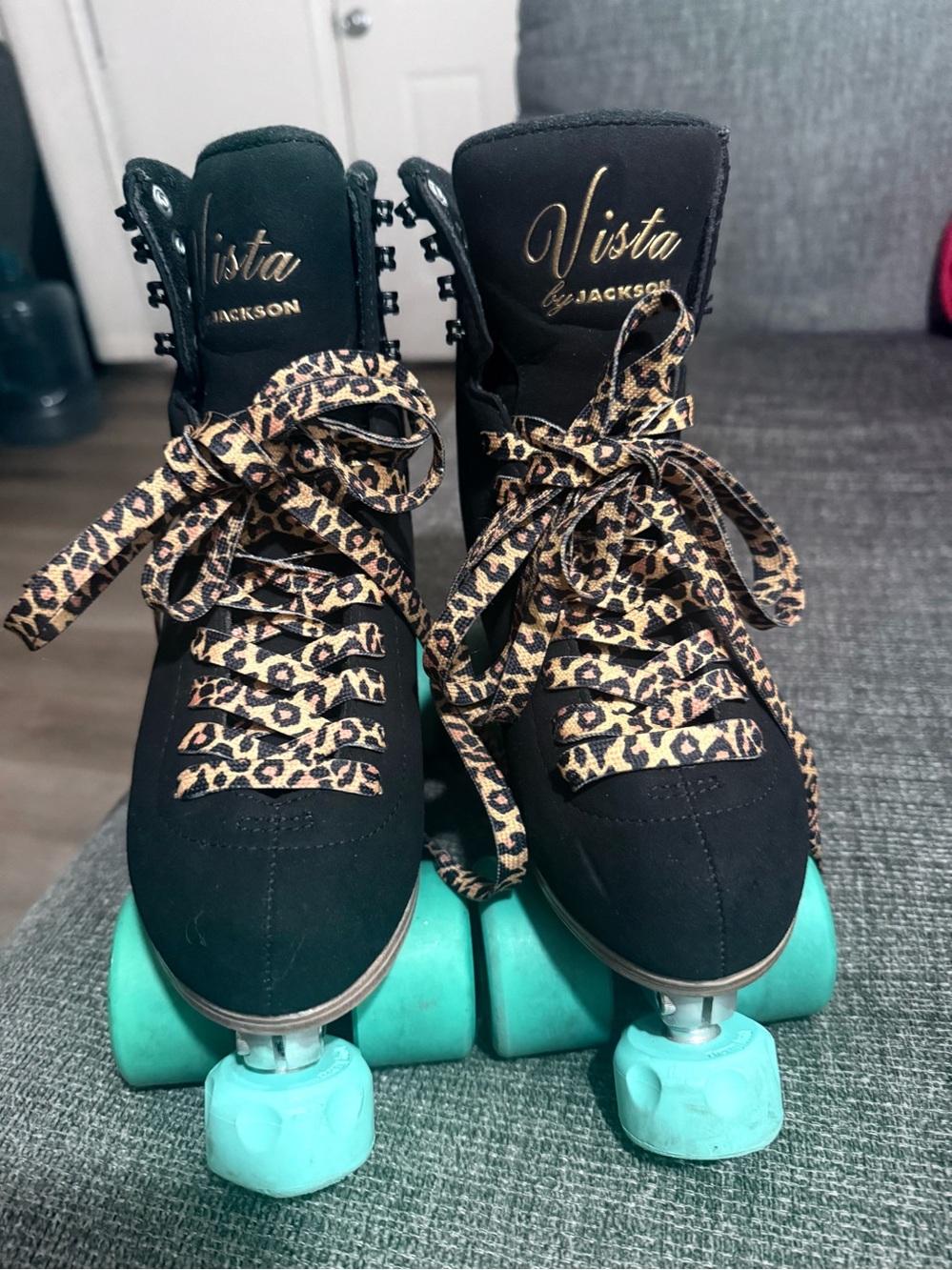 Women’s Black Roller Skates with Leopard Laces and Teal Wheels